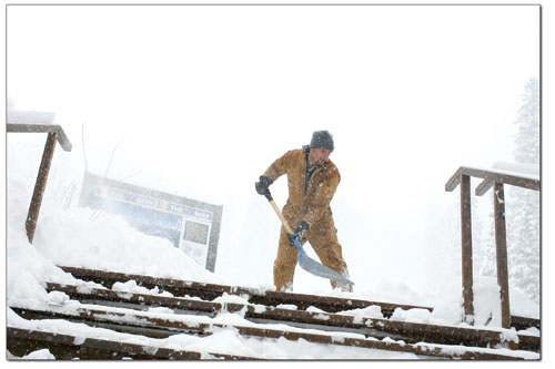 Erick Ireland shovels a set of stairs at Durango Mountain Resort
on Tuesday Morning after a foot of fresh snow had fallen.