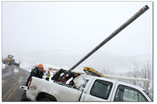 CDOT employee Paul Wilson readies the avi-launcher before firing
explosives into the starting zone of an avalanche path that
otherwise might cross the road unexpectedly.
