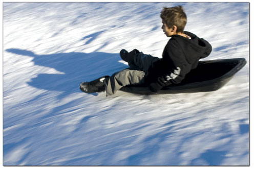 Ethan Lotfinia, 9, races down a popular sledding hill in Wildcat
Canyon.