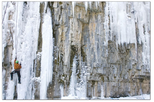 A climber makes his way up a curtain of ice during a
demonstration.