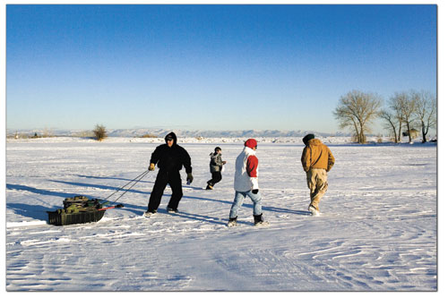 Phil Gonzales, left, Eric Gonzales, Kathy Gonzales and Toby
Walker head for the car after a fish-less day at Pastorius
Reservoir earlier this week.