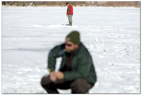 C.W. Aton, foreground, and Sam Johns fish separate areas of
Pastorius Reservoir recently.