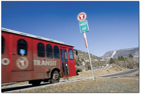 One of nearly a dozen buses and trollies passes a stop along
Highway 550. The trolley goes as far north as the Days Inn.