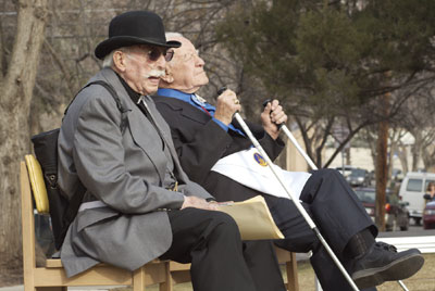 Mike Darmour, left, and Arthur Lemmon soak up some afternoon sun
before the events started Friday.