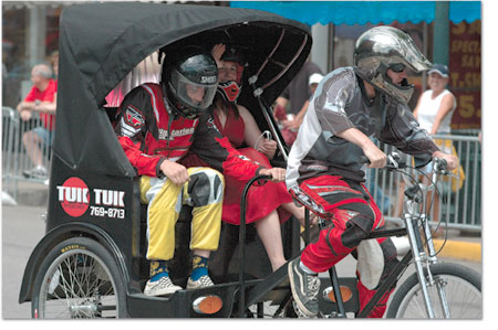 Marc Snider pedals the Tuk-Tuk in this years Cruiser Crit./Photo
by Frank Mapel