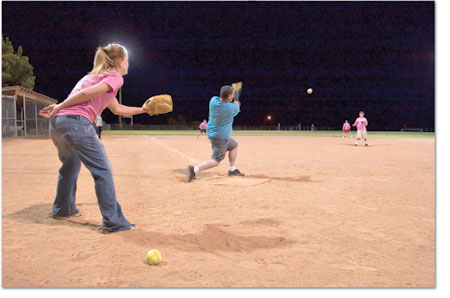 You cant win em all. Melissa Topey, left, watches as Lil Ruth
crushes the ball into center field.
