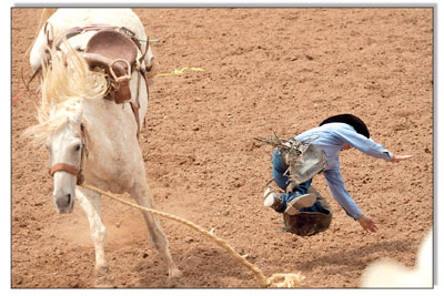 Local legend Tom McCarthy prepares to eat some dirt during the
saddle bronc competition on Sunday.