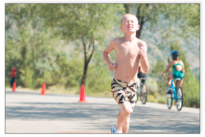 James Berndt, 9, fights through the pain on his run. James went  on to win the gold in his age division.