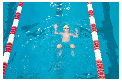 Stowe Brunso, 9, demonstrates his enormous backstroke in his  lane on Saturday morning