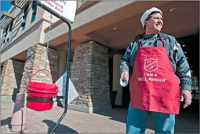 Richard Archuleta, volunteering for La Plata Electric, is busy
ring-ding-a-ding-dingin away Monday morning outside the Durango
Mall.