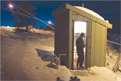 Liftie Shannon Cruise works the lonely upper station on Saturday
evening with nothing but a space heater and a radio.