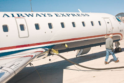 Roy Jenkins gasses up a commercial flight on the tarmac in front
of the La Plata County Airport.