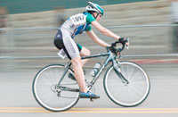 A competitor in the Pro Womens Division begins her skinny-tire
lean into a turn during the 45-minute race.