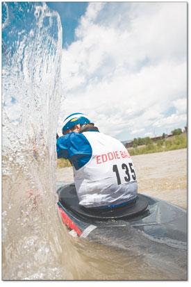 Corey Nielsen creates a wall of water with the first stroke of
his paddle during Saturdays slalom.