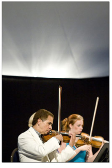 Guillermo Figueroa and fellow violinist Chloe Trevor, right,
perform Shostakovichs Octet on Tuesday night.