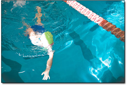 Sabina Tamburrino, 7, takes the last few strokes of her
swim.