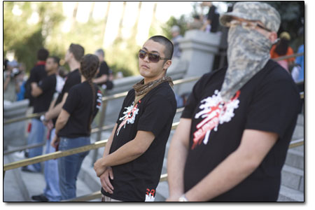 Members of Recreate 68 stand guard on the steps of the State
Capitol on Sunday during a speech by Ron Kovic, the paralyzed
Vietnam vet turned political activist whos memoirsBorn on the
Fourth of Julyinspired the Academy-Award winning movie.