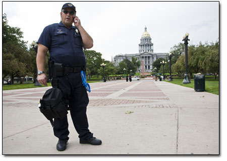 1981 FLC graduate-turned-Denver-policeman, Tony Burkhardt,
stands watch on Saturday.