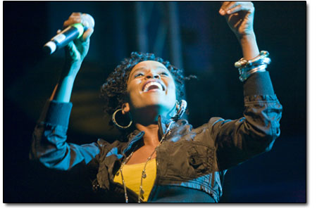 Jamaican-born Cherine Anderson dances along the bank of speakers
at the edge of the stage during, Hey World.