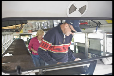 Bruce and Nancy Ehlenbeck exit the bus in an orderly fashion
after dropping off their donations on Saturday morning.