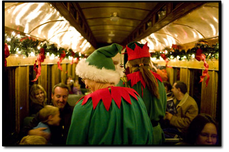 Santas elves help with greeting the passengers as Santa makes
his way from car to car.