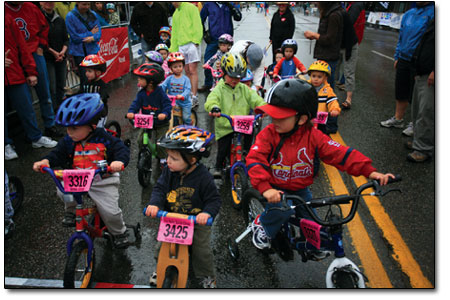 Champions of tomorrow: Kids 5 years and younger take to a wet
starting line at the kids race on Sunday morning.