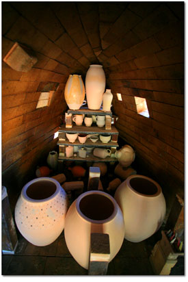 Each pot is strategically placed in order to facilitate the
proper distribution of flames and heat within the kiln.