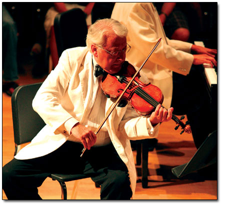 Arkady Fomin, director of the Music in the Mountains
Conservatory, performs on violin.