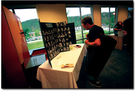 An audience member takes a gander at the portraits of junior
musicians.