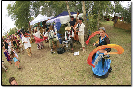 A band of gypsies serenade the crowd with tradtional music.