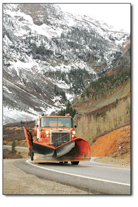 A CDOT snow plow makes a dry run up Red Mountain Pass.
