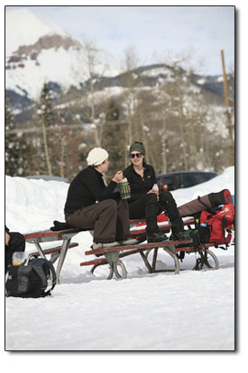 Roxie Vangemeren, left, and Shannon Cruise enjoy a snack outside
the rustic warming hut.