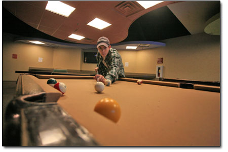 Forrest Connor concentrates on a clutch shot at the billiards
table.