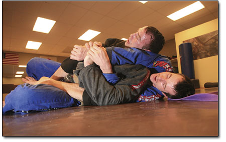 Chris Jones, top, and Kevin Wirth partake an intense grapple
session.