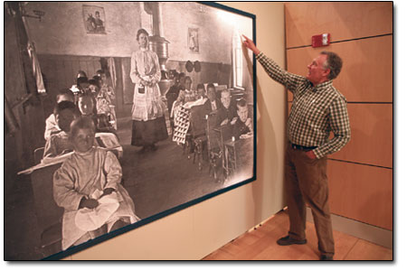 Director of Community Services Ken Francis explains a classic
tale of frontier school life in this early 1900s photo.