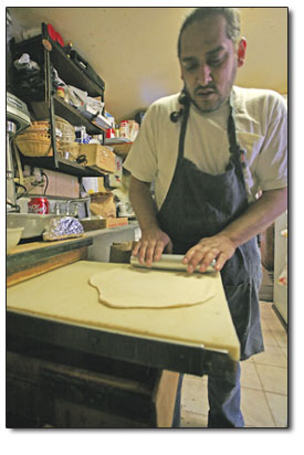 Dennis Trujillos son, Dominic, rolls out fresh dough for
soon-to-be sopapillas.