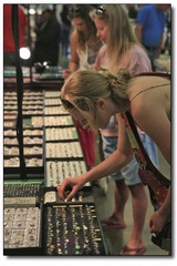 Shoppers peruse one-of-a-kind jewelry and trinkets at the show